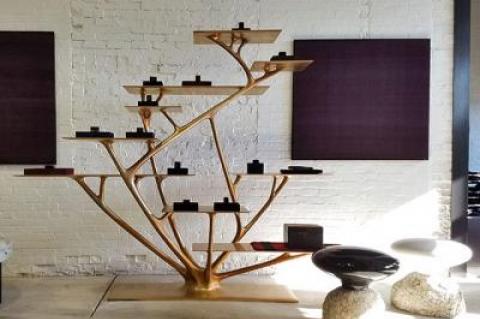 Conrad de Kwiatkowski’s small basalt objects are placed on a Joris Laarman bronze etagere, with the Aymara weavings he has collected over the years hanging behind them.