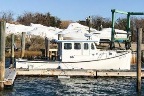 The columnist’s boat sat alone at its dock this week among those that have already been pulled out of the water.