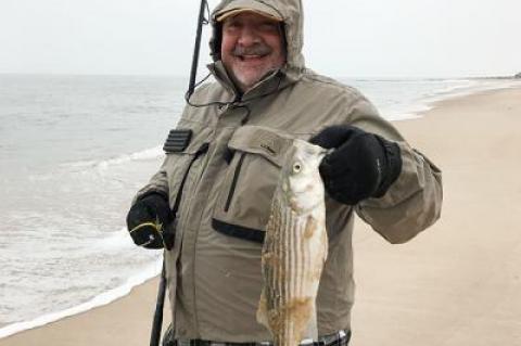 Joseph Fosella landed this striped bass near Georgica Beach in the snow on Saturday morning.