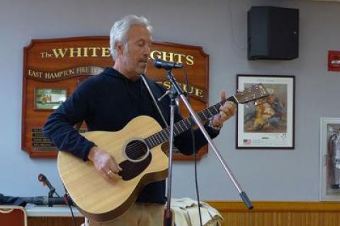 Paul Fried voiced his support for lifting the ban on amplified live music by singing for the village board.