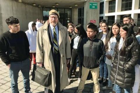 Daniel Rodgers, in hat, with friends and supporters of Bryan Siranaula, who was indicted yesterday in State Supreme Court in the alleged rape of a woman in the Springs School parking lot on Feb. 4. Mr. Siranaula entered not guilty pleas to the charges.