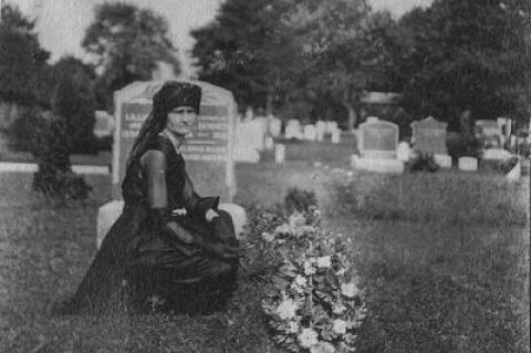 Lillian Swezey Skinner at the grave of her husband, Ira Skinner of Southampton, who died on March 13, 1919, during the flu pandemic.