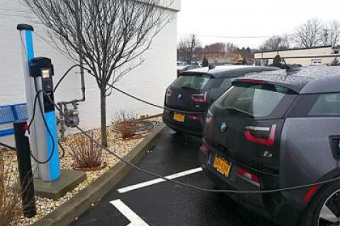 A sign of things to come: Electric cars fueled up at parking meter-style electric pumps at the Southampton BMW dealership.