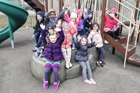 Children in the Eleanor Whitmore Early Childhood Center's prekindergarten program enjoyed time on the playground Monday after the regular school day was over.