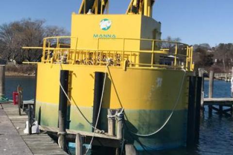 The Manna Fish Farm automatic fish-feeding station, now docked at Prime Marina in Hampton Bays