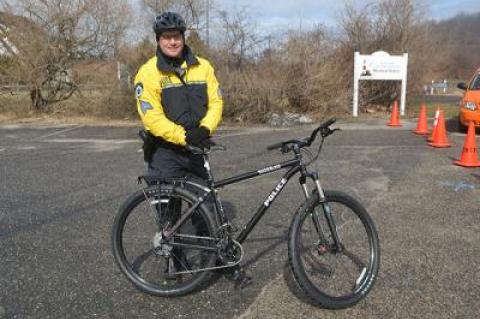 East Hampton Town Police Sgt. Dan Roman with one of two state-of-the-art patrol bicycles, now part of the department’s fleet