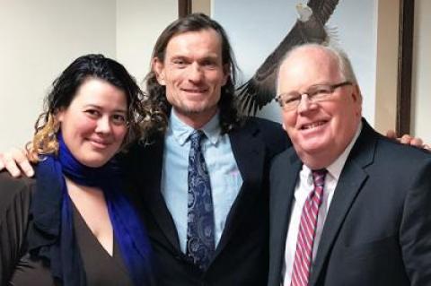 A jury found James Henry, a tenant in Northwest Woods, not guilty of violating East Hampton Town’s rental registry law. After the verdict was announced, he posed with his girlfriend and housemate, Katlyn Albrecht, and his attorney, Lawrence Kelly.