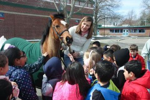 Joanne Jiminez of Hamptons Pony Parties and Jiminez Jumpers brought Annie the pony to meet first graders at the John M. Marshall Elementary School during a lunchtime Brown Bag enrichment event on Friday.