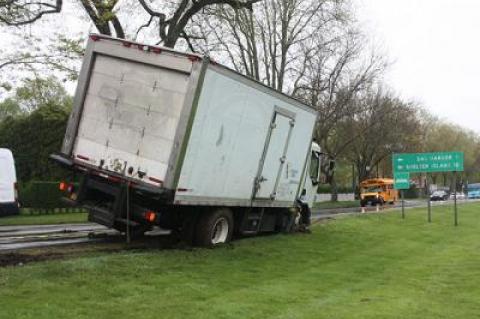 A six-wheeled box truck loaded with cargo got stuck on May 16 when it was driven off the road and onto the steep edge of the village green on East Hampton’s Main Street. Village Police Detective Sgt. Greg Brown said heavy rain played a role in the mishap. Police called Rapid Recovery to tie down the truck and winch it off the dirt so that it did not tip over. No tickets were issued.