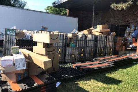 Packages have piled up outside the Montauk Post Office, as the Postal Service works to "align resources" to assist the office with the massive seasonal increase in package volume.