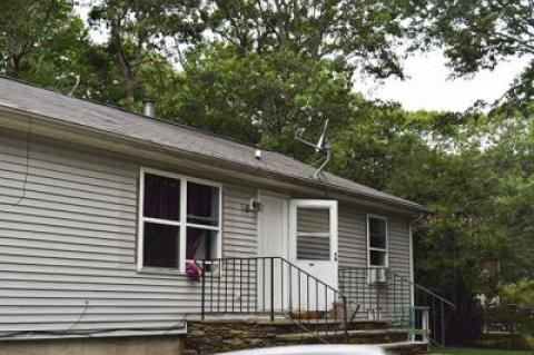 The East Hampton Town Police Department, along with the town’s Ordinance Enforcement Department, building inspectors, and fire marshals, executed a search warrant at this house on Railroad Avenue, off Abraham’s Path, just after 6 a.m. on Sunday.