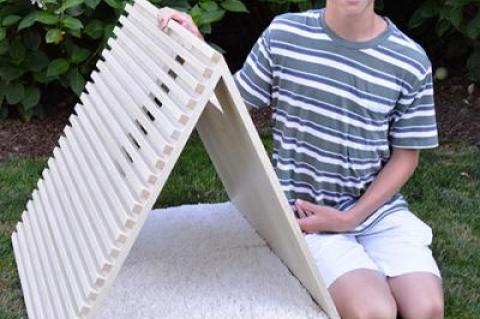 Luke Louchheim, 14, next to his Alpha Dog house, designed and built for his arfITECTURE project, 10 houses available for auction to benefit the Animal Rescue Fund of the Hamptons.