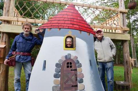 Posing with the castle-themed tree house they constructed for East Hampton Village’s fall festival were, from left, Toby Haynes, Jeanie Stiles, and David Stiles.