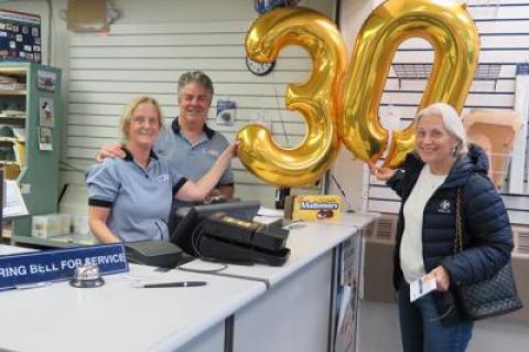 Bruce Howard, who has worked at the Montauk Post Office for 28 years, celebrated 30 years with the United States Postal Service on Monday with his co-worker Jeanne Stevens and a postal patron, Judy Morton.