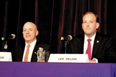 Perry Gershon, left, and Representative Lee Zeldin, right, met at the Hampton Bays High School on Monday for one of their only face-to-face debates of the campaign.