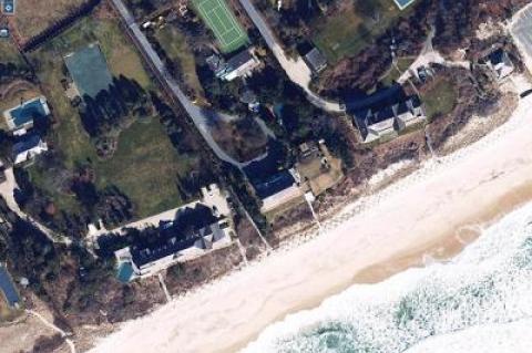 The owners of 33 Lily Pond Lane in East Hampton, at center, want to replace their house with one larger and farther removed from the ocean shoreline.