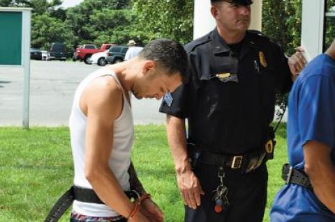 William Crespo-Duran, seen here being led into East Hampton Town Justice Court back in August, will face a Suffolk County Criminal Court judge in April for sentencing on charges related to a Montauk drug bust last summer.