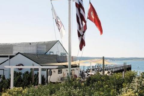 The Town of East Hampton and Marc Rowan, the billionaire co-founder of the private equity firm Apollo Global Management who bought Perry B. Duryea & Son Inc., the wholesale-retail fish market with dining on Fort Pond Bay in Montauk, have settled a lawsuit.