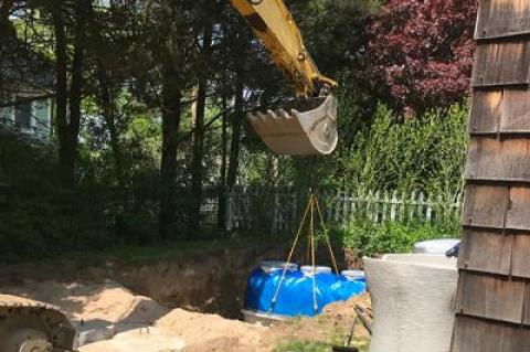 By taking advantage of two programs, a county grant and a town rebate, Tim Sheehan and Kate Rossi-Snook were able to install a new nitrogen-reducing septic system at their Shelter Island property. Now they are among the county residents finding out that the grant counts toward their taxable income.