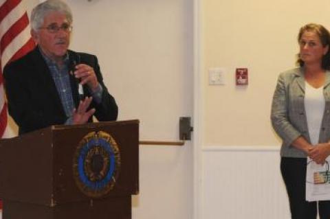 Following her presentation Monday on the East Hampton Housing Authority's proposed affordable housing complex in Amagansett, Katy Casey, the group's executive director looked on as Town Supervisor Larry Cantwell addressed the large crowd gathered in the American Legion Hall.