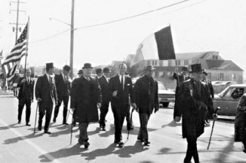 The Friends of Erin in the 1969 Montauk St. Patrick's Day Parade with Gil Keller, grand marshal, as they made their way up Edgemere Road. Below left, Mike Egan, the first grand marshal, showed how it was done in 1963.