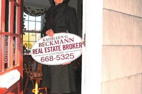 After more than a decade, Kathleen Beckmann has taken down the business sign in front of her house and joined forces with Town and Country Real Estate.