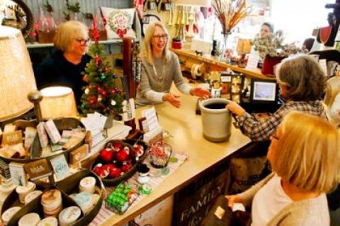 Vicki Nolan, center, helped customers at the Country Lane gift shop in Sag Harbor. With the sale of the building imminent, she is closing the shop after 20 years.