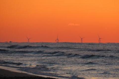 The Block Island wind turbines were visible at dawn on Monday from the ocean beach in Montauk.