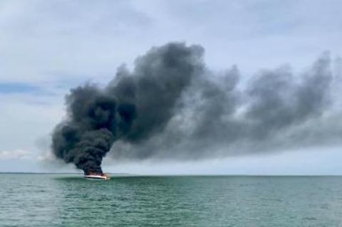 Three people are safe after being rescued from a burning boat near Gardiner's Island Friday afternoon.