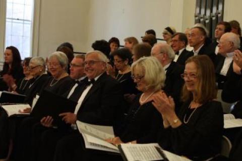 The Choral Society of the Hamptons during a warm up session