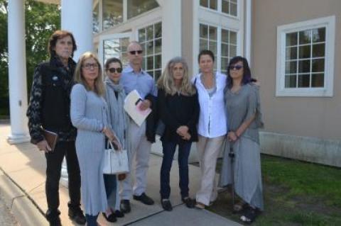 About 40 friends and fellow Ross School parents showed up last Thursday at East Hampton Town Justice Court to support of Arthur W. Bijur of Amagansett, center, who was arraigned on a charge that he violated the Suffolk County Social Host Law, which prohibits adults from allowing underage drinking at their residences.