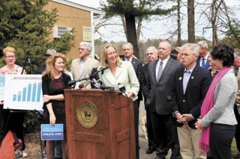 County Legislator Bridget Fleming, center, was among the officials who support County Executive Steve Bellone’s proposal for a referendum to tax water bills to create a water pollution abatement fund.