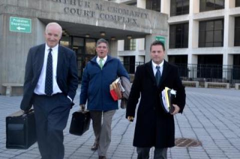 Steven Lee, right, left the courthouse after the first day of his trail on a felony charge of illegal surveillance. With him were his attorneys, Patrick O'Connell, left, and James O'Shea.