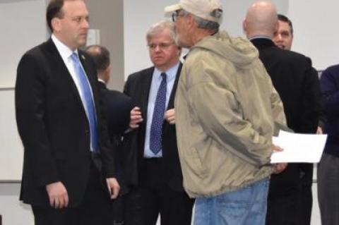 Representative Lee Zeldin and other officials mingled with constituents and colleagues before the hearing began. Assemblyman Fred W. Thiele Jr. can be seen to the right of Mr. Zeldin.