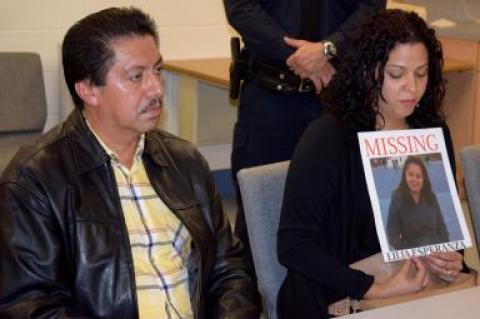 Maria Duchi holds a poster with her aunt, Lilia (Esperanza) Aucapina's photograph on it. Ms. Duchi spoke at a press conference about Ms. Aucapina's disappearance, along with Ms. Aucapina's brother, Victor Parra, left.