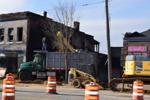 On Tuesday morning, demolition workers continue to take away the debris after knocking down the Compass building in Sag Harbor.