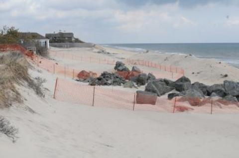 Contractors began work to construct a rock revetment in front of Mollie Zweig's house in November, but a temporary restraining order stopped the project two days later.