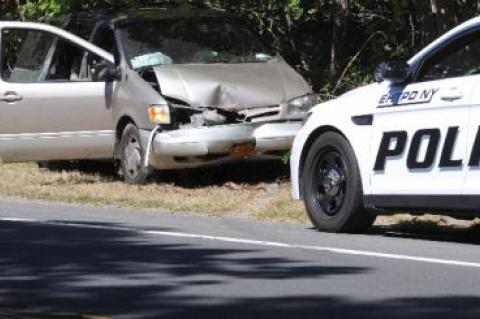 The driver was injured after her minivan hit a tree on Route 114 in East Hampton Monday morning.