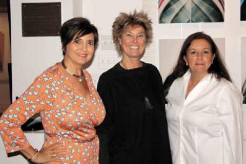 Terry Thompson, Edwina von Gal, and Anahi DeCanio posed in front of Michele Dragonetti’s boat prow collection at Ashawagh Hall in Springs Saturday night.