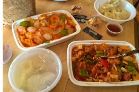 The offerings from New Best Taste in Amagansett, clockwise from lower left: wonton soup, shrimp in Szechuan chili sauce, vegetable dumplings, and General Tso’s chicken.