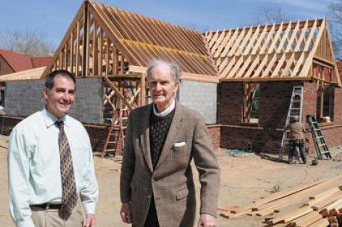 Dennis Fabiszak, East Hampton Library’s director, and Donald Hunting, president of the library’s board of managers, outside the 6,800-square-foot expansion, presently under construction.