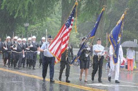 Marchers in the East Hampton Memorial Day parade were undaunted by heavy rain.