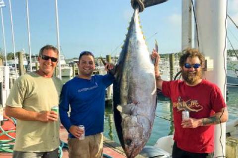 Traveling to Atlantis Canyon, Pat Byrne, right, weighed in a 234-pound bigeye tuna last Thursday at Star Island Marina in Montauk. With him were Chris Byrne, center, and Capt. Mike Elling.