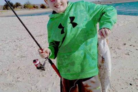 Canyon Ross hooked his first striped bass of the season at Louse Point in Springs.