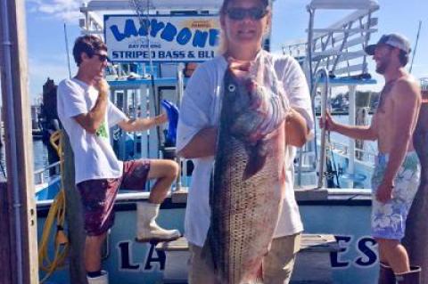 Nina Neumayer landed this 32-pound striped bass on the Montauk party boat Lazybones.