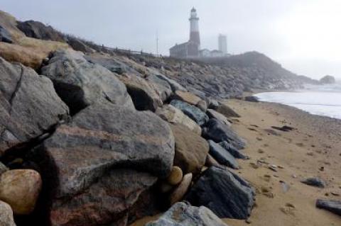 The rock revetment protecting the Montauk Lighthouse is to be reconstructed and enlarged to better protect the historic landmark from the ocean and extreme weather.