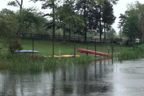 High water encroached on a lawn at Georgica Pond in East Hampton on Thursday afternoon