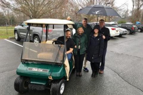 Eric Casale, the Springs School principal, was behind the wheel of a golf cart newly donated by the East Hampton Golf Club for use in emergencies. Next to him, from left, were Debra Winter, the district superintendent, Chris Varga, a school security officer, Laura Foty, an administrative assistant, and Tom Barnard, the club's general manager.