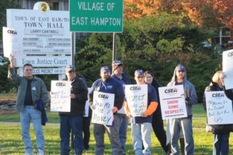 Town employees protested outside of Town Hall on Monday.