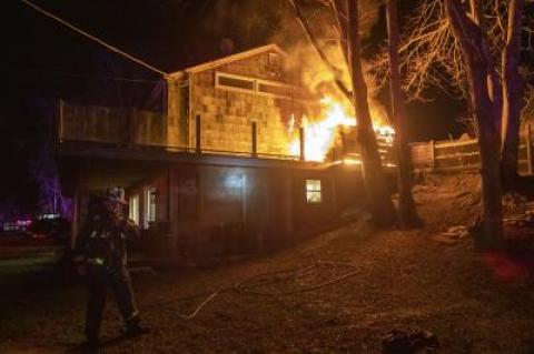 Flames were spreading from the deck to the house.